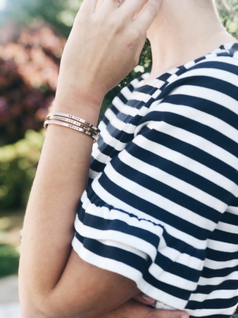 stack of mantraband bracelets