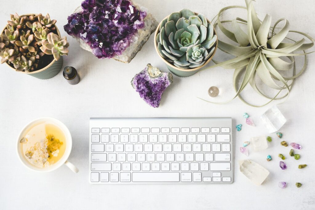 keyboard with tea and crystals