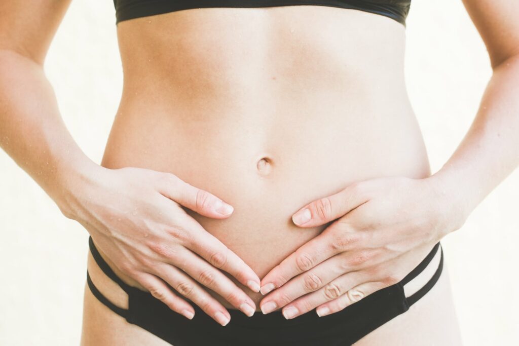 woman with her hands on her stomach