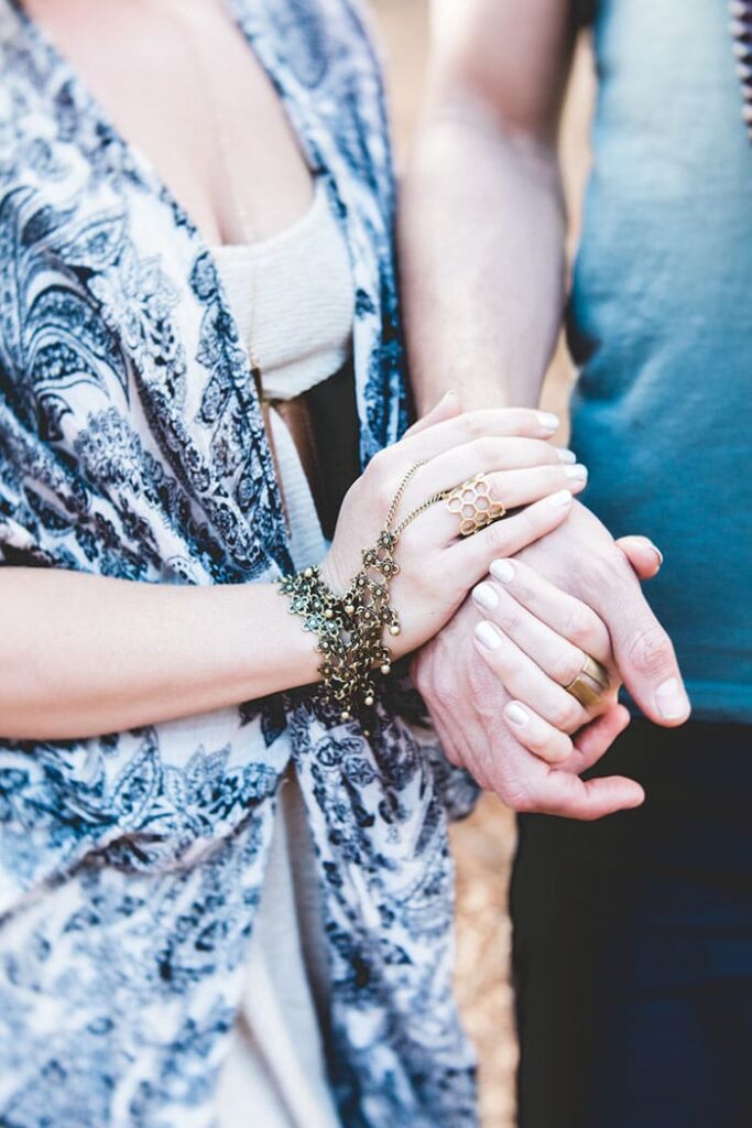 couple holding hands and preparing for pregnancy