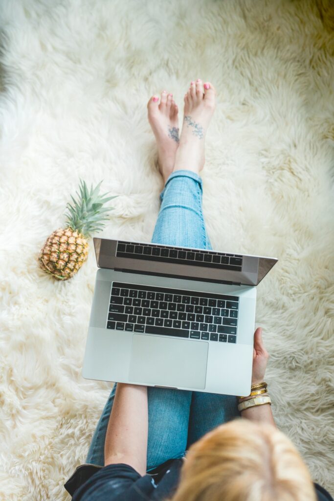 woman writing on her laptop