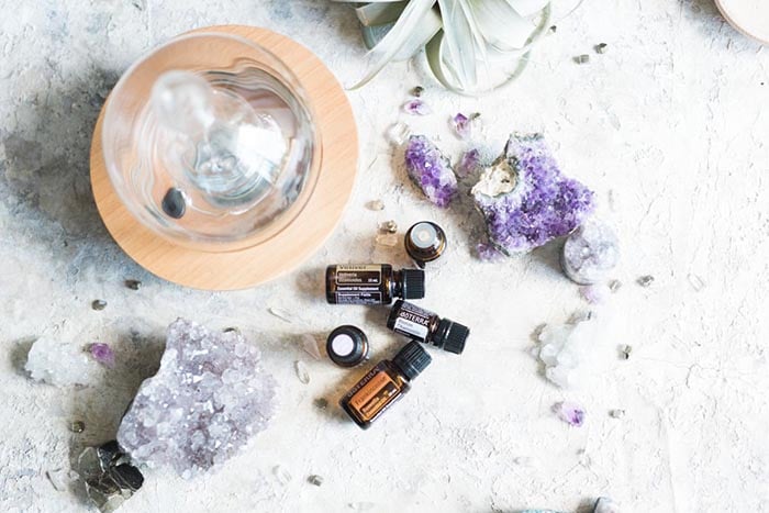 essential oils with crystals and a diffuser