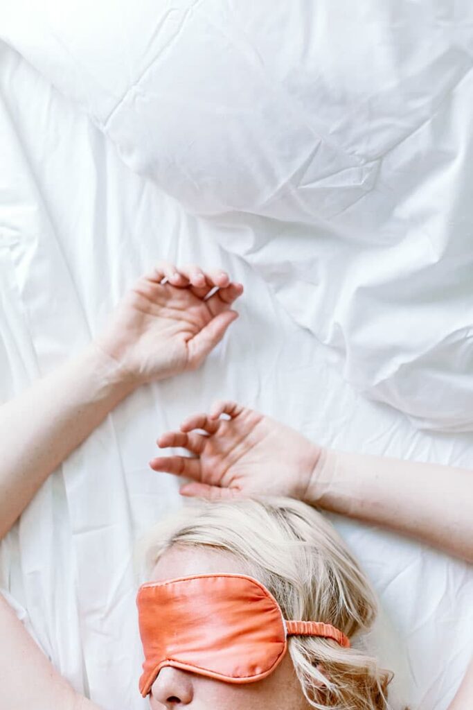 woman sleeping with a face mask on