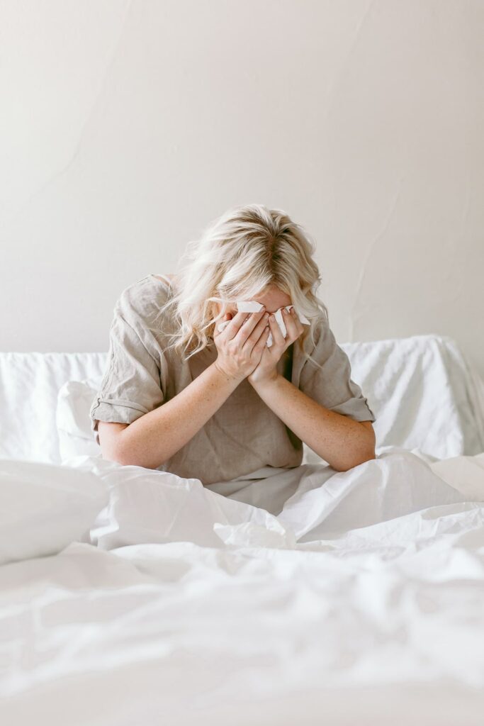 woman crying in bed