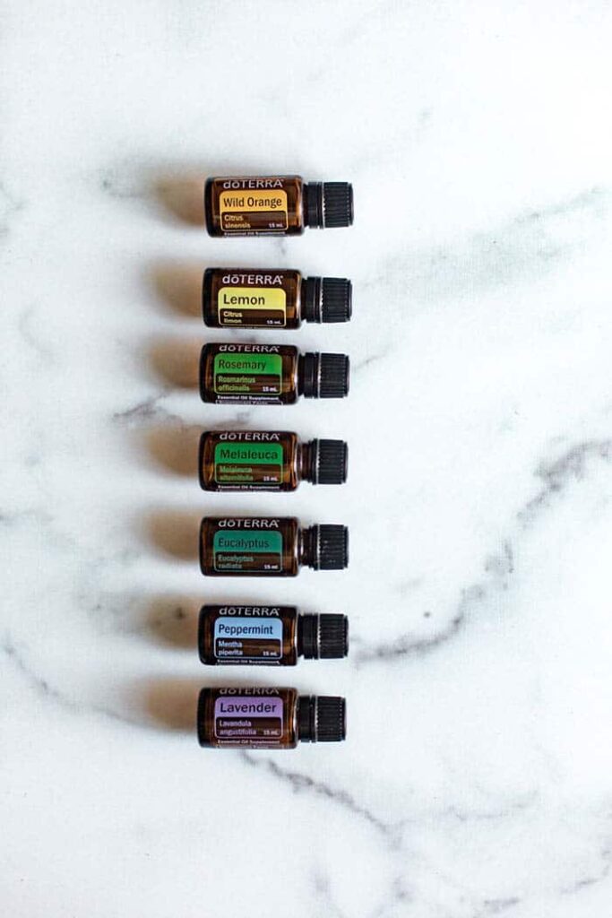 stack of essential oils on a marble counter top