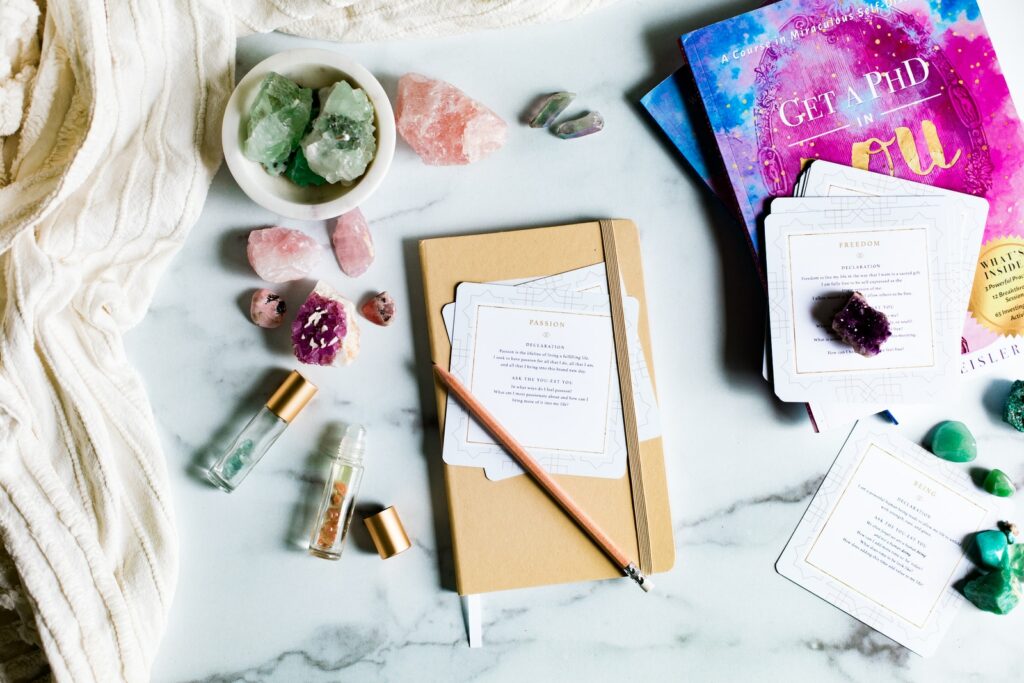 journal with helaing crystals and essential oils