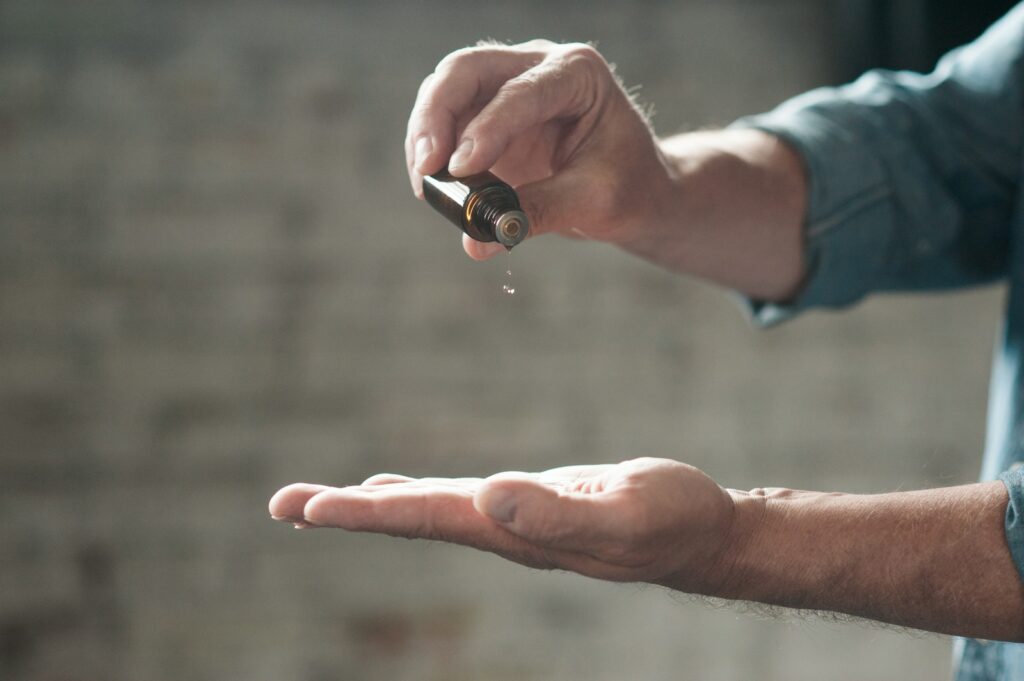 man using essential oils