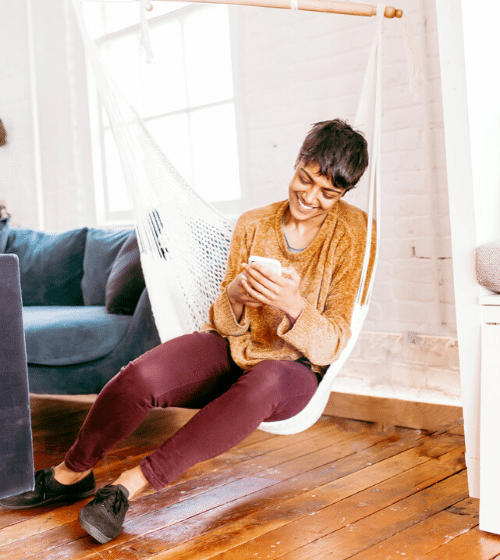 woman sitting in hammock giving up control