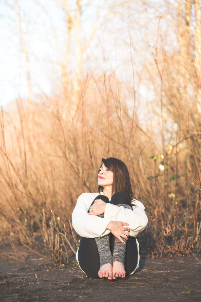 Woman meditating outdoors