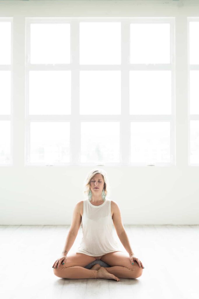 woman meditating in wellness studio