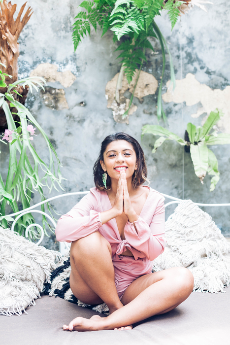 woman meditating outside in nature