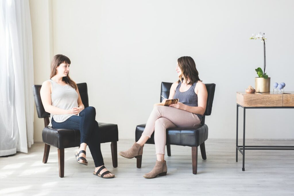 Two women sitting and talking