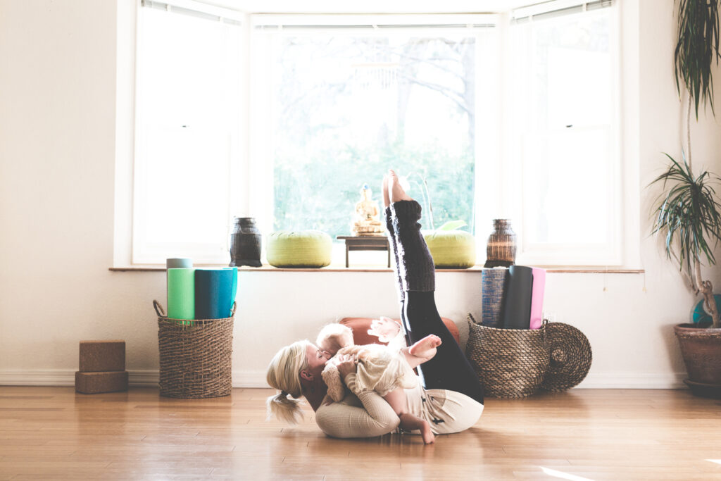 Mom and baby doing yoga at home