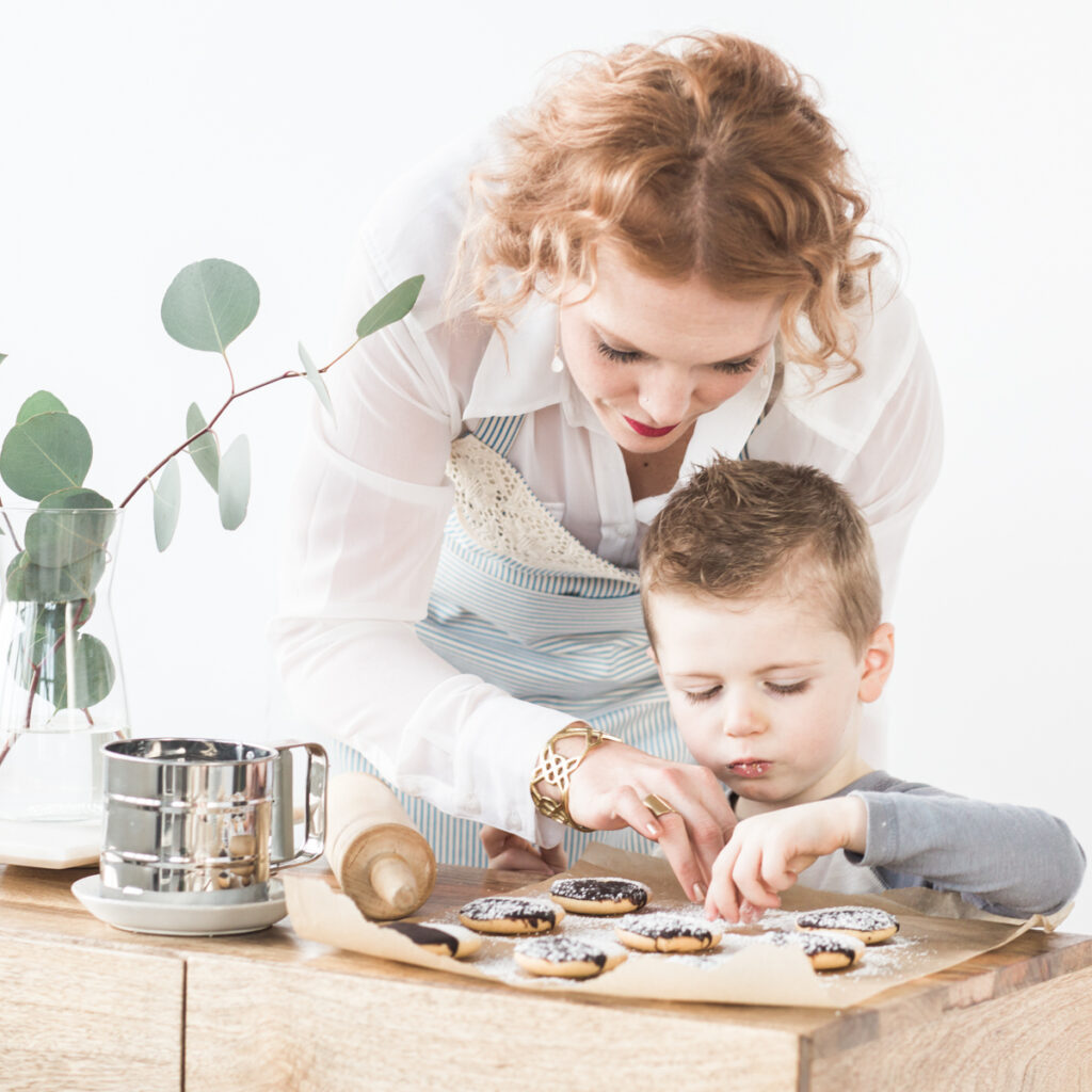 mother and son baking cookies together