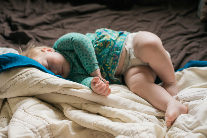 baby sleeping on comfortable blankets