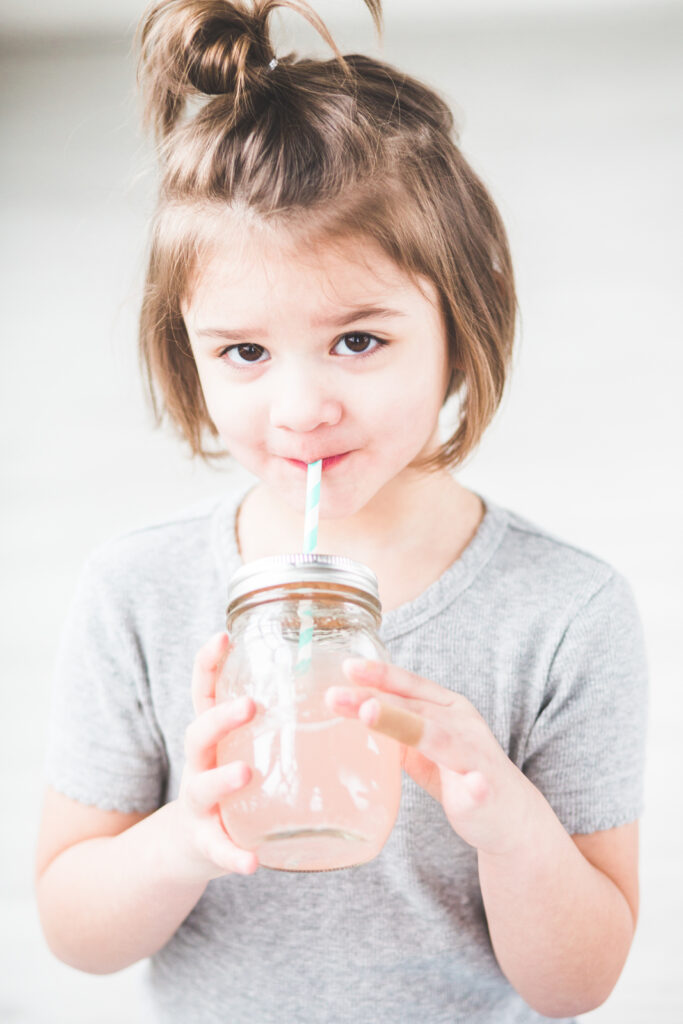 child drinking juice