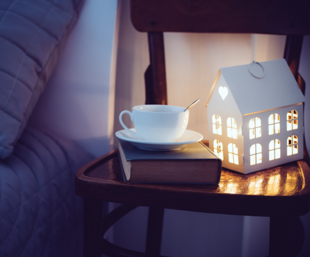 bedside table with nightlight and tea