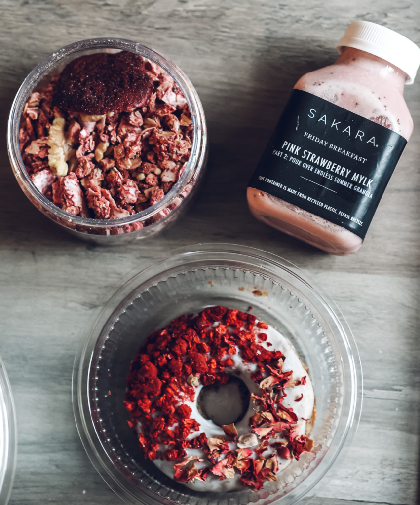 assortment of Sakara meals on a coffee table